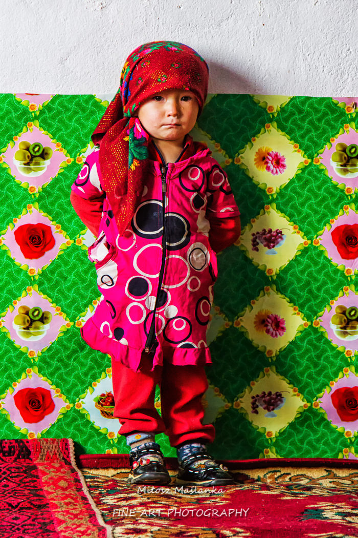BOLONKUL, TAJIKISTAN - JULY 2, 2015: Kids in Bolonkul village, Pamir, Tajikistan.. Bolonkul is one of the coldest places