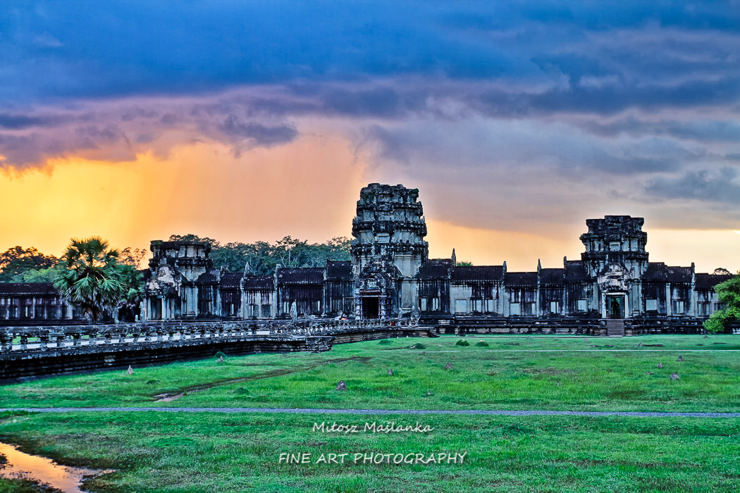Angkor Wat temple - the former Khmer Empire at dramatic sunset with a thunder in a background, Cambodia
