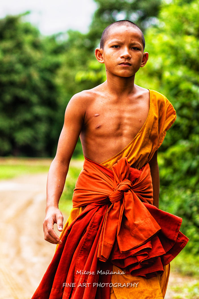 4000 ISLANDS, LAOS - SEPTEMBER 22:  Monk walking in direction of the temple in 4000 Islands, Laos on September 22, 2011.