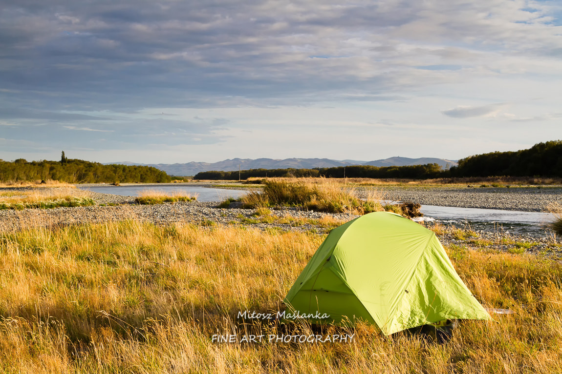 Lonely tent set up on a grass on South Island, New Zealand
