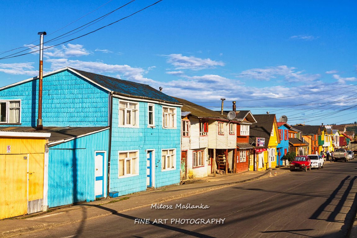 Row of vivid colourful timber, wooden houses, Castro, Chiloe