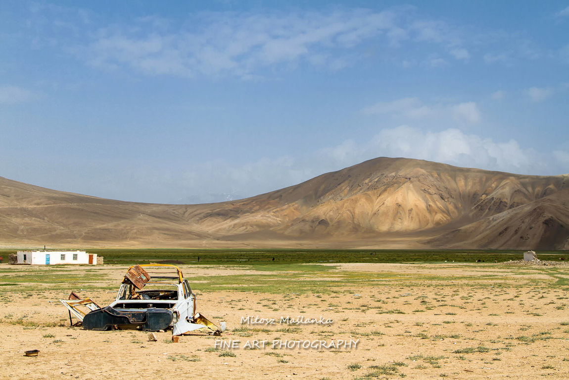 Old car body rusting in the Pamir mountains, Tajikistan, Central Asia