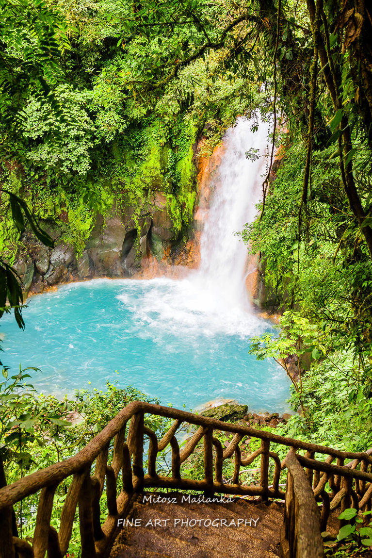 Beautiful waterfall in northern Costa Rica inside the Tenorio National Park with a bright turquoise color in the water