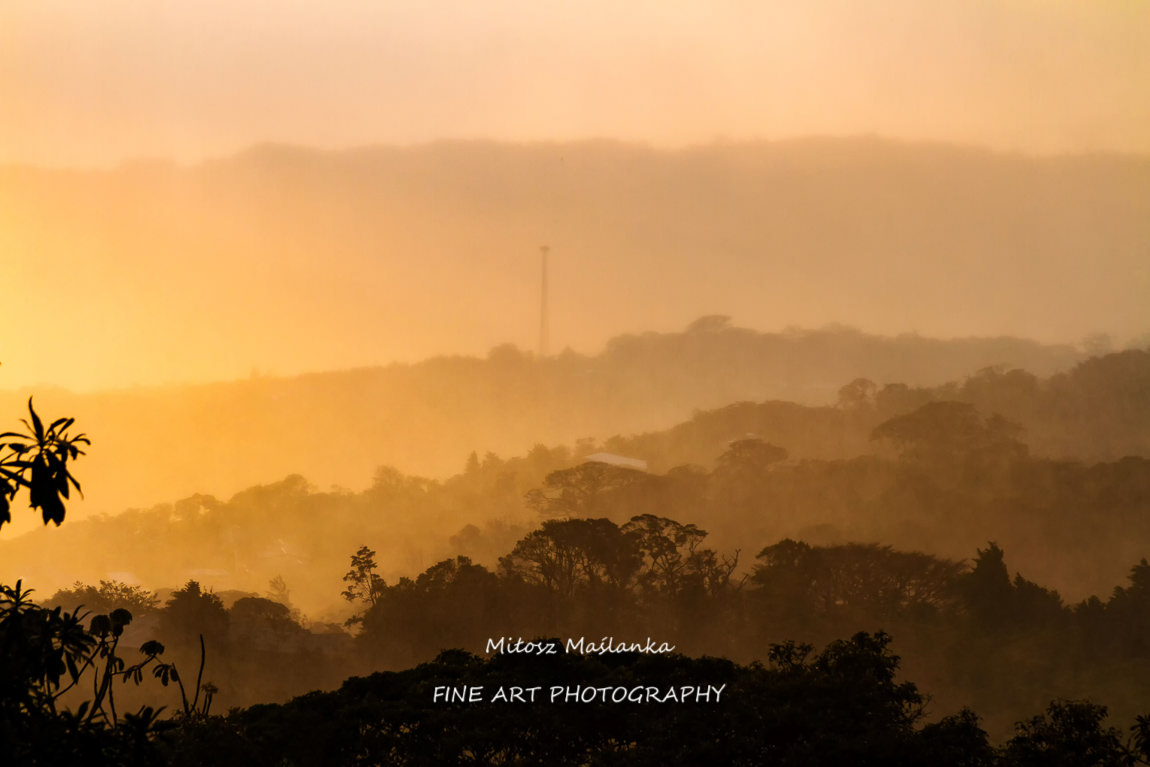 Foothills of Monteverde, Santa Elena in Costa Rica highlands. Panoramic view in beautiful orange sunset day of a vast hills and mountains in this pristine region of Central America