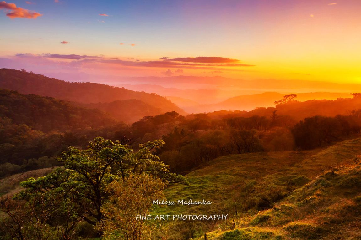 Foothills of Monteverde, Santa Elena in Costa Rica highlands. Panoramic view in beautiful orange sunset day of a vast hills and mountains in this pristine region of Central America