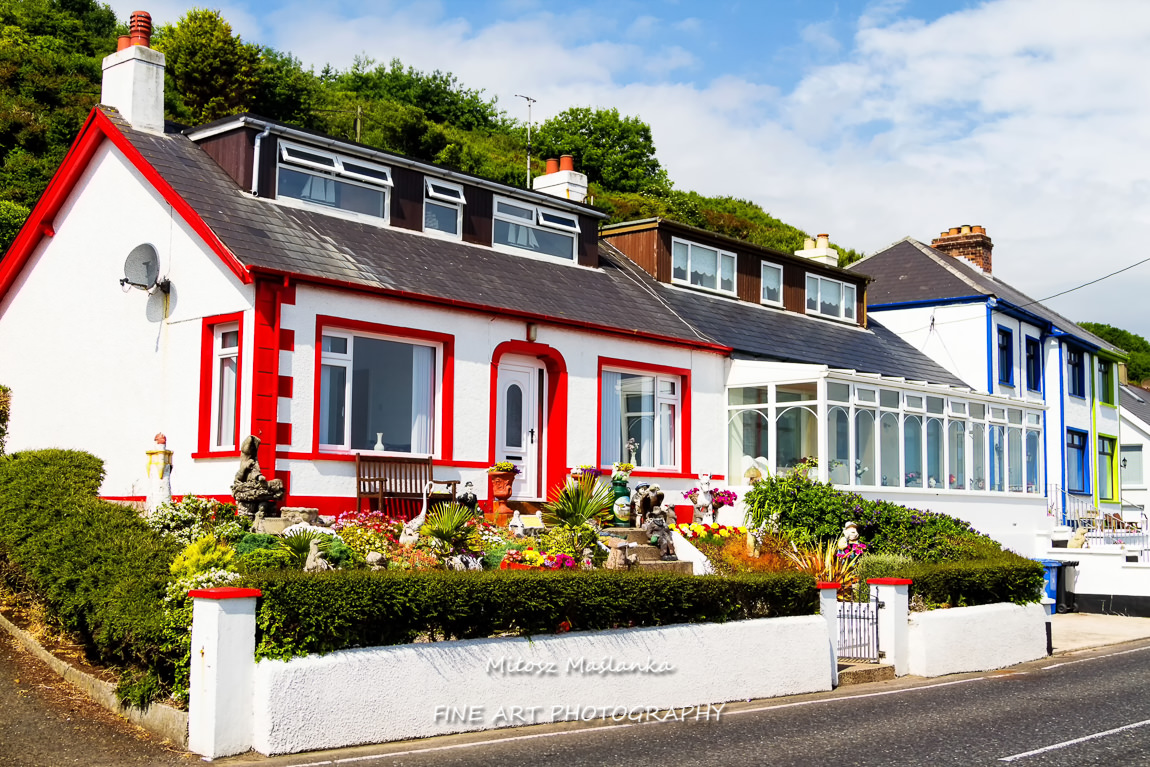 Beautiful, pretty and colorful summer house on the Irish coast.