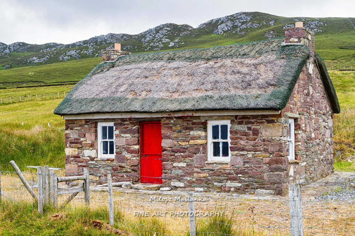 Beautiful, typical, pretty and colorful summer house on the Irish coast.