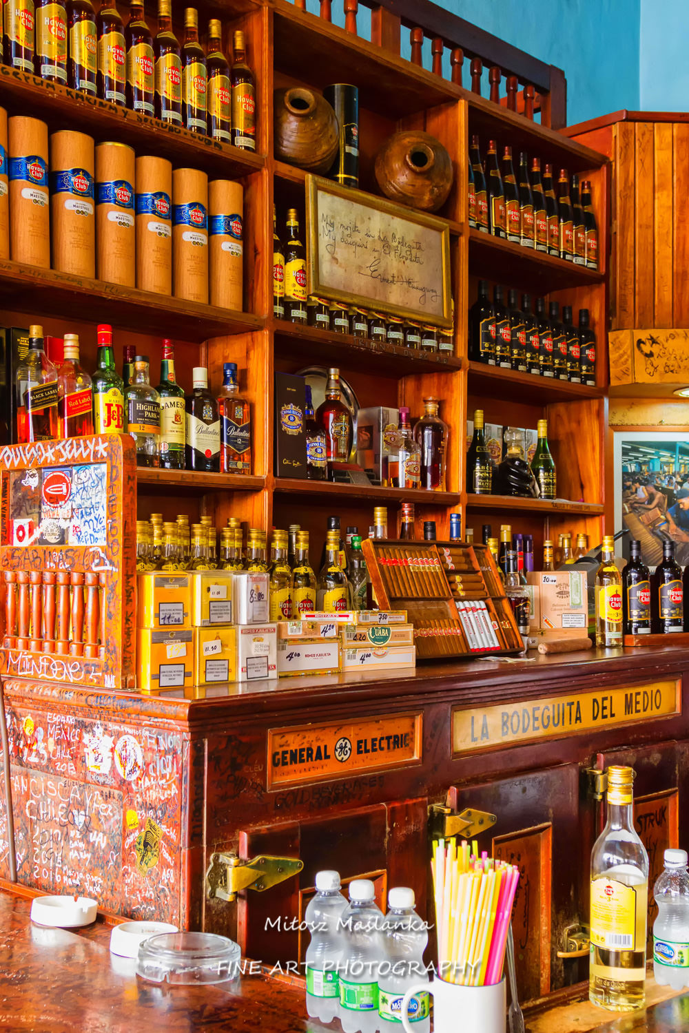 La Bodeguita del Medio in Havana. The birthplace of mojito. View of the shelves inside the restaurant. In this pub Ernest Hemingway used to come for a drink.