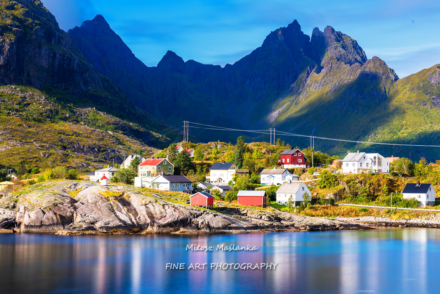 Houses perched on a rock by the sea